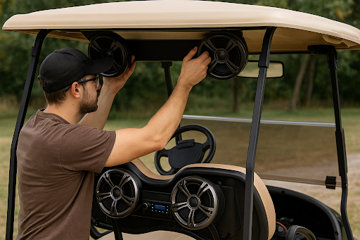 Technician installing speakers in a golf cart at Golf Carts Mafia in Shelbyville.