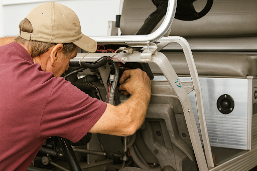 Mechanic performing a golf cart tune-up at Golf Carts Mafia shop in Shelbyville, IN.